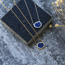 Load image into Gallery viewer, Two bright blue lapis lazuli gemstone necklaces with gold flecks in sterling silver and 14k gold on black stone on stone background

